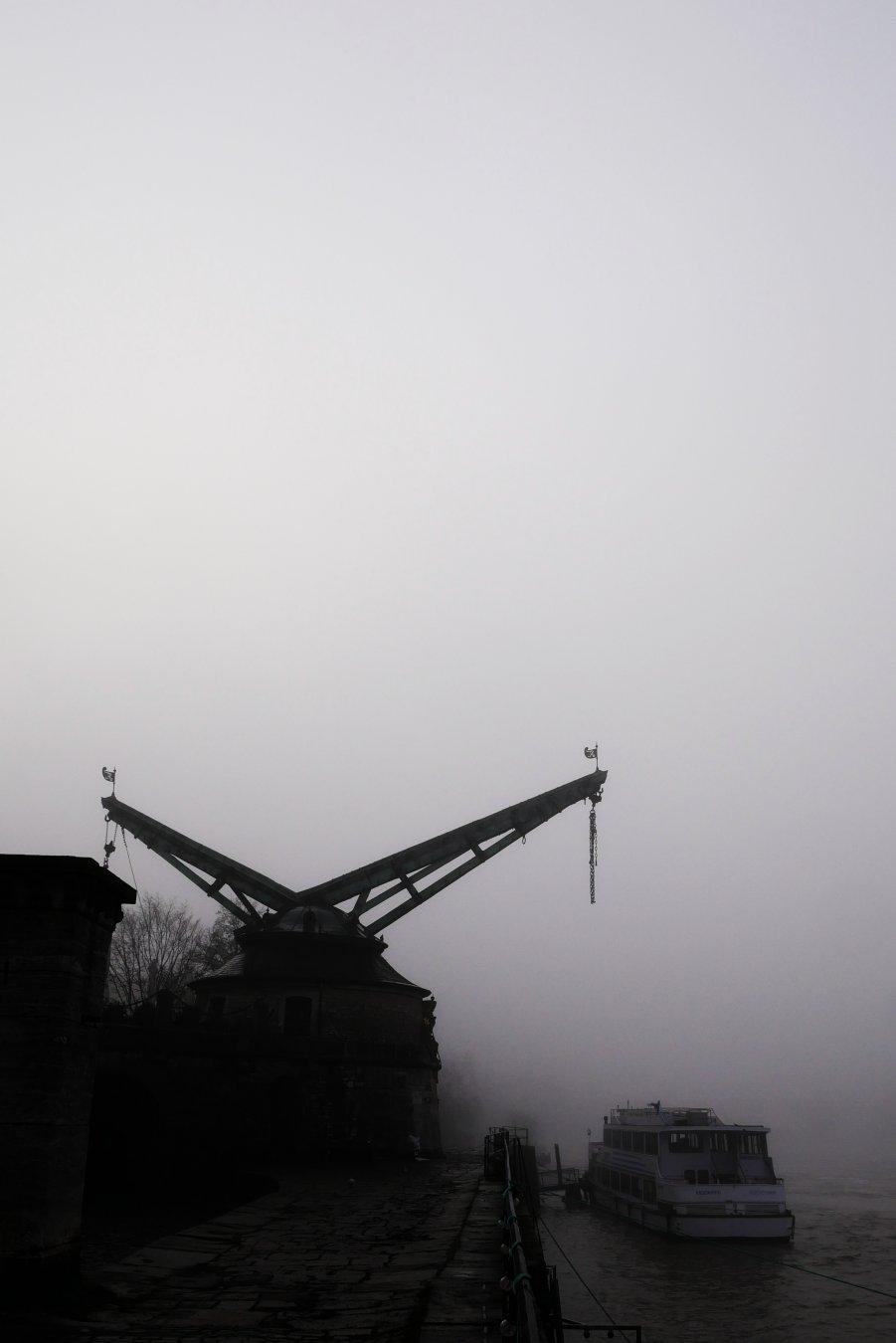 Foggy morning at Main river banks in Würzburg, Germany