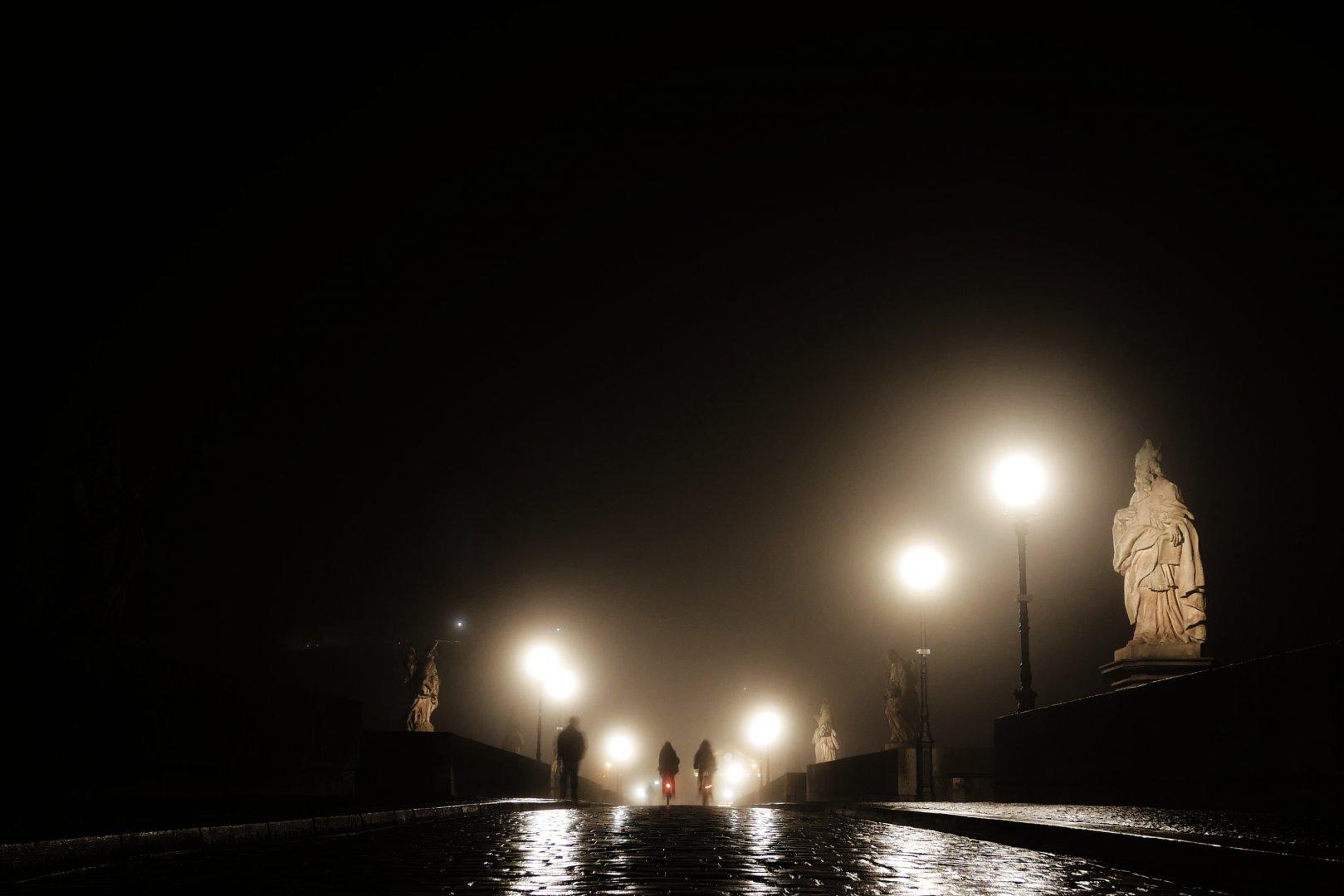 Foggy night on a bridge in Würzburg, Germany