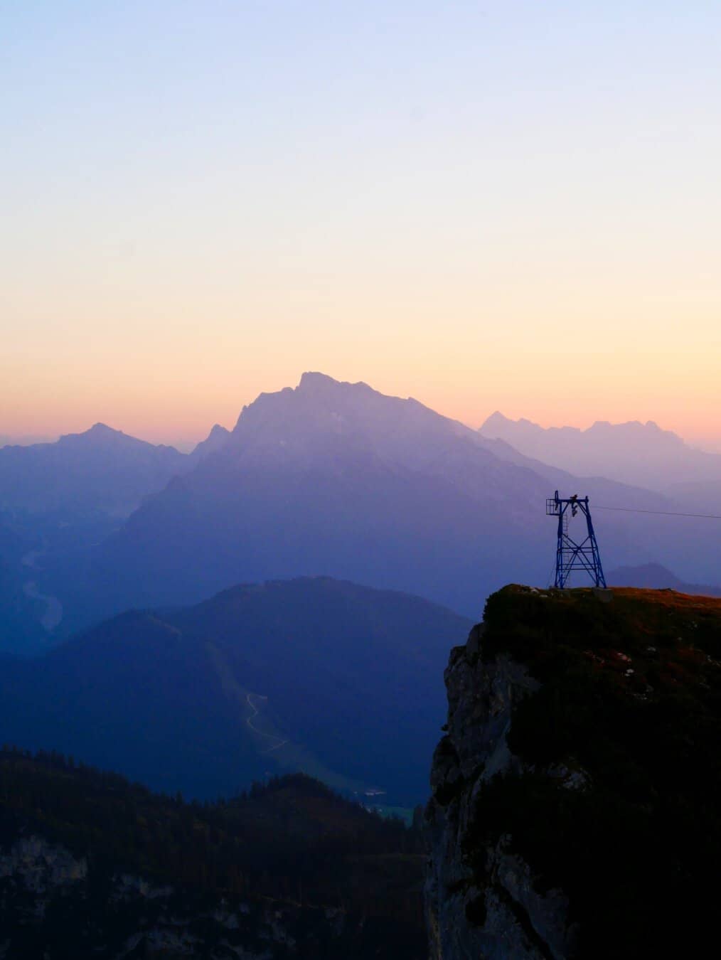 Pylon of a material lift near Stöhrhaus in Bischofswiesen, Germany with the Alps in the background